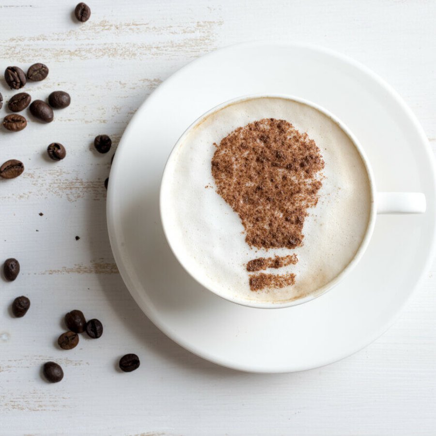 Coffee with lightbulb made of cinnamon. Brain storm or idea concept. Coffee-break.